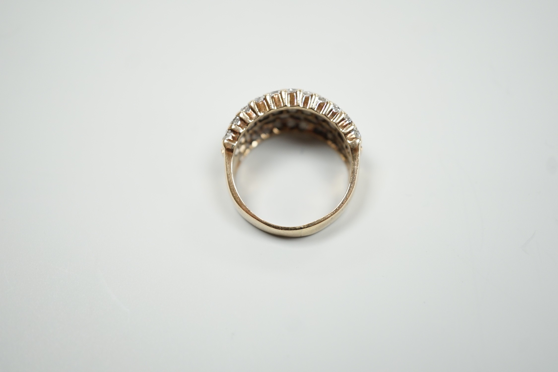 A modern yellow metal and pave set five row diamond dress ring, size R, gross weight 9.2 grams.